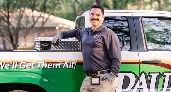 technician standing in front of truck